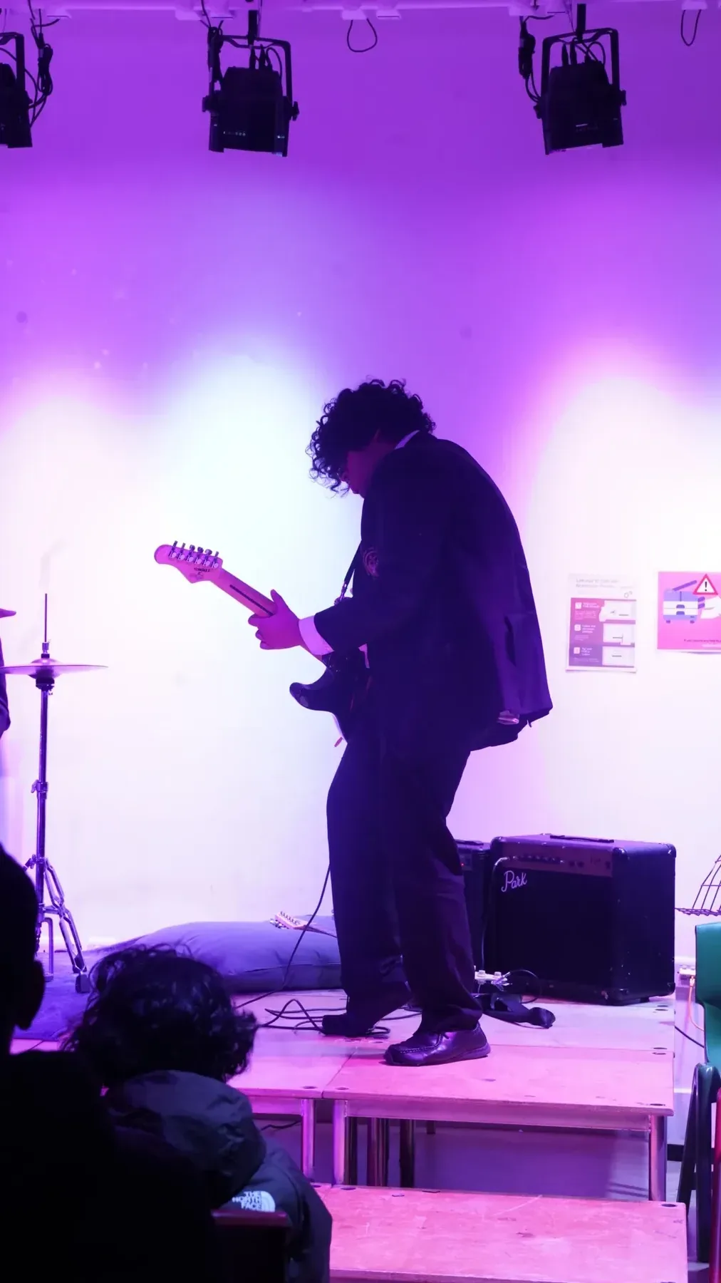 Guitarist mid-performance on stage